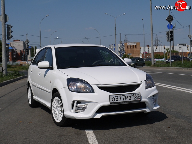 10 999 р. Передний бампер Vita Dm  KIA Rio ( 2 JB,  4 FB) (2005-2024) дорестайлинг седан, дорестайлинг, хэтчбэк 5 дв., рестайлинг, хэтчбэк 5 дв., рестайлинг седан (Без сетки, Неокрашенный)  с доставкой в г. Омск